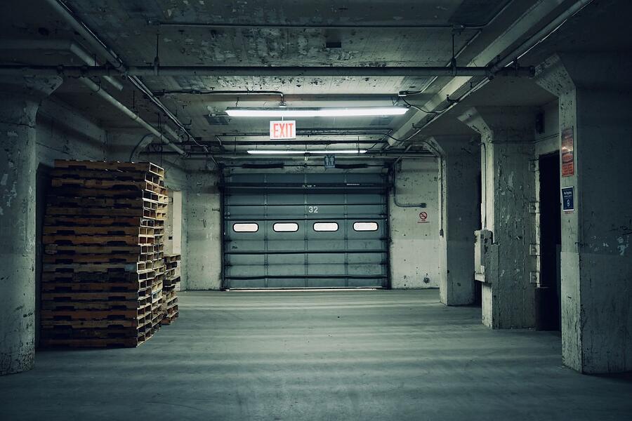 A roll-up door and loading dock at a warehouse